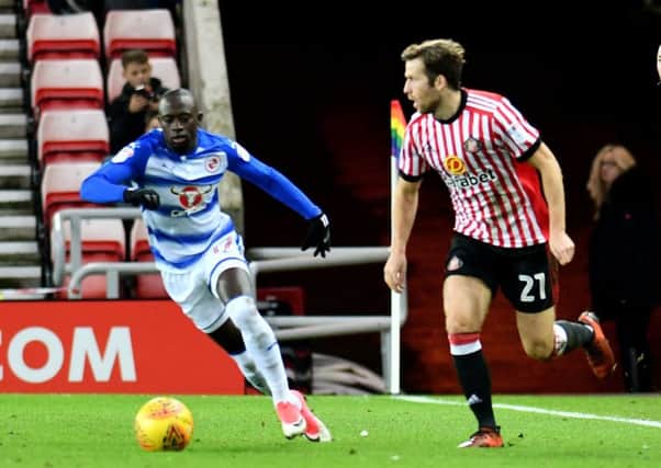 Adam Matthews takes on Reading winger Mo Barrow. Picture by Frank Reid