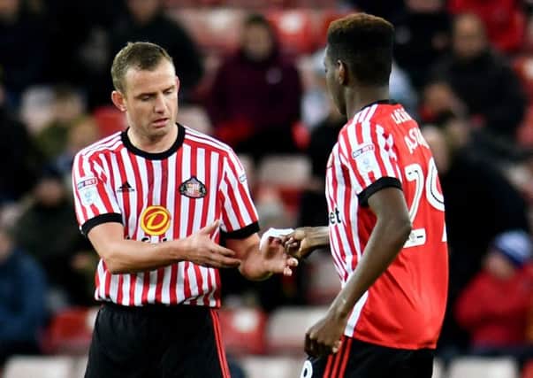 Joel Asoro passes an instruction to Lee Cattermole. Picture by Frank Reid