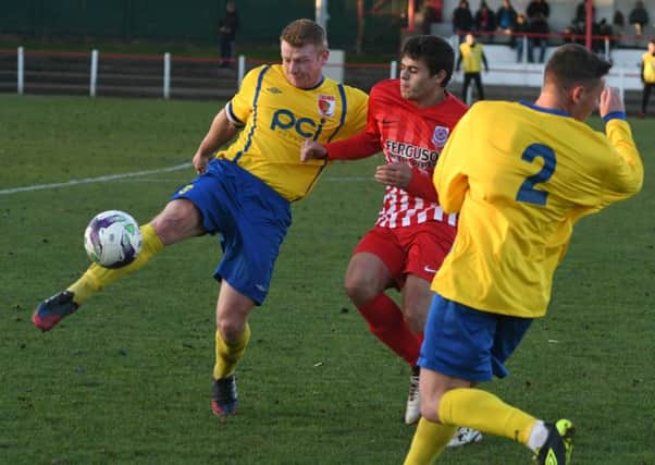 Sunderland RCA's Ross Preston (yellow) clears in last month's clash with Seaham Red Star