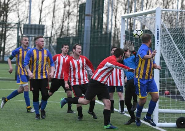 Wear United (blue/yellow) score their second goal against Lakeside in the Sunderland Sunday League last week. Picture by Kevin Brady