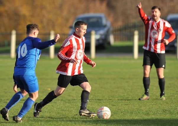 Sunderland West End (stripes) take on Windscale in their last game a fortnight ago