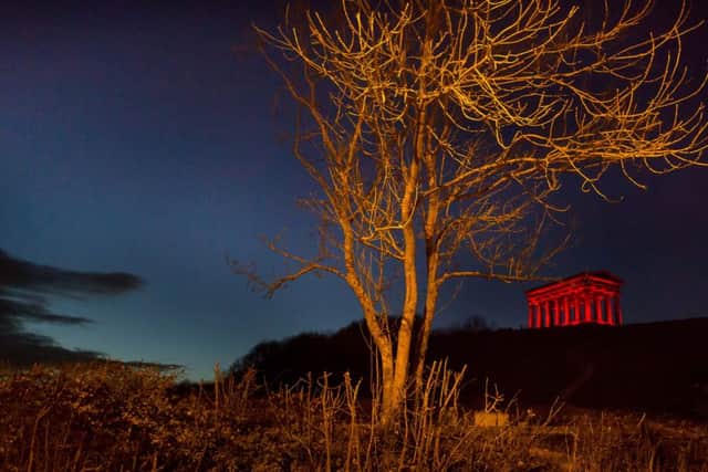 Penshaw Monument in Sunderland is lit up red as part of the React to Red campaign on World Stop the Pressure Day.
