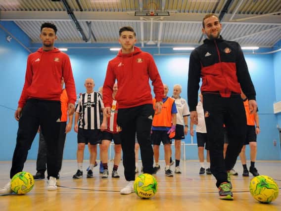 Brendan Galloway, Lynden Gooch and Mika at the Everyone Active walking football session. Picture courtesy of SAFC.