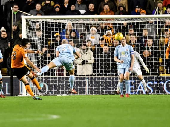 Darron Gibson makes a block in the draw with Wolves.