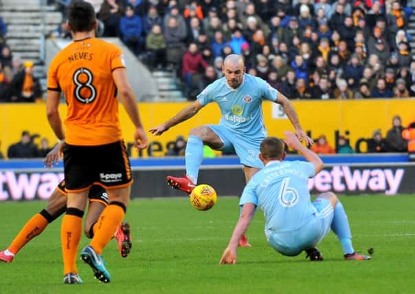 Darron Gibson takes control of proceedings as Lee Cattermole loses his footing.