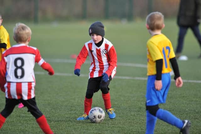 Russell Foster Mini Soccer Under 9s Winter League clash between Farringdon Detached, red and white, and North East Sport Real.