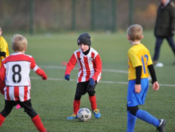 Russell Foster Mini Soccer Under 9s Winter League clash between Farringdon Detached, red and white, and North East Sport Real.