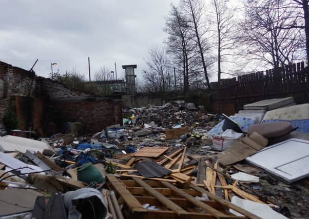 Jonathan Finn was charged with operating an illegal waste site