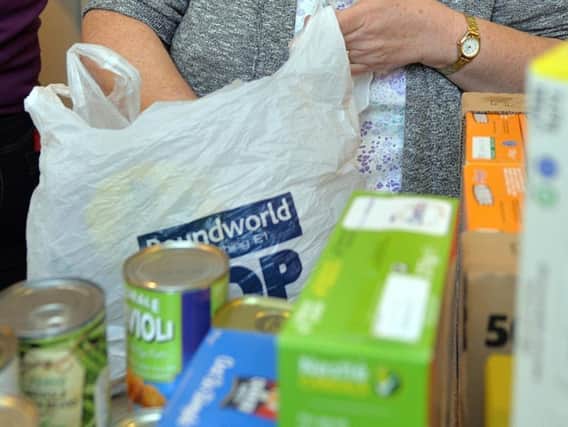 Volunteering at a foodbank is one way of helping someone less well off than ourselves this Christmas.
