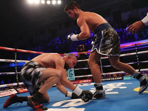 Josh Kelly puts down Jean Michel Hamilcaro. Picture by LARENCE LUSTIG/ MATCHROOM
