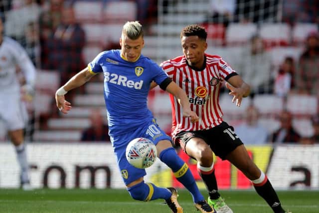 Leeds United's Ezgjan Alioski and Sunderland's Brendan Galloway battle for the ball during the Sky Bet Championship match at the Stadium of Light, Sunderland. PRESS ASSOCIATION Photo. Picture date: Saturday August 19, 2017. See PA story SOCCER Sunderland. Photo credit should read: Richard Sellers/PA Wire. RESTRICTIONS: EDITORIAL USE ONLY No use with unauthorised audio, video, data, fixture lists, club/league logos or "live" services. Online in-match use limited to 75 images, no video emulation. No use in betting, games or single club/league/player publications.
