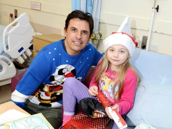 Sunderland boss Chris Coleman meets seven-year-old Abi Smith during a Christmas visit to Sunderland Royal Hospital.