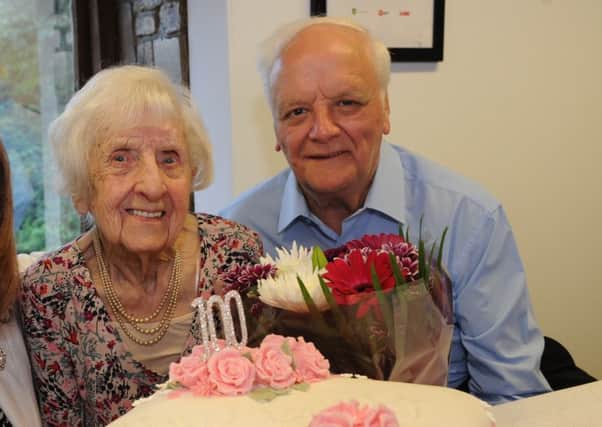 Wyn Davison celebrating her 100th birthday, with nephew Ron Clark.