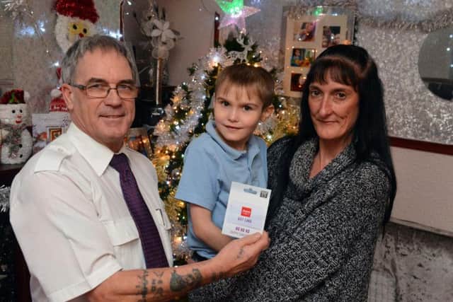 Sunderland Echo Dear Santa runner up, Lucas Winney, 8, with mum Sharon Winney and Steve Hamilton from Stagecoach North East who donated the voucher.