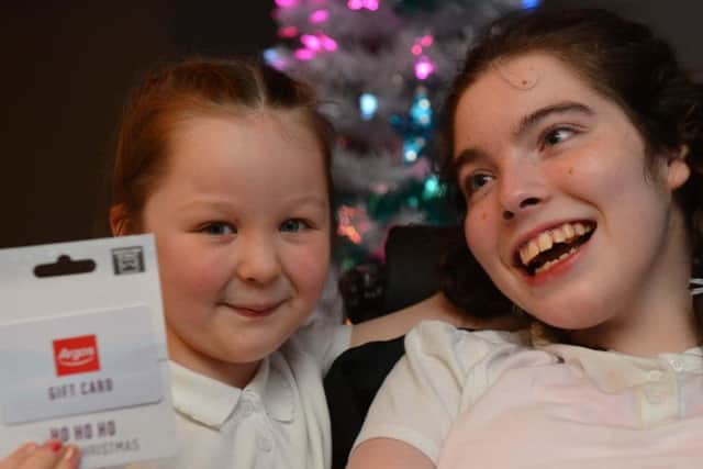 Sunderland Echo's Dear Santa runner up Laila-Mae McAneny, 6, with sister Courtney Collier, 14.