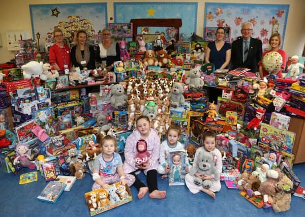 Hope 4 Kidz hand over gifts from the Echo Toy Appeal to the children's ward at Sunderland Royal hospital. Pictured are; back row; Carole Davison, Shannon Crowder (Hope 4 Kids), Sue Brown (trustee Hope 4 Kids), Aimee Burns (Hope 4 Kids), Brian Dodds chair of Hope 4 Kids and 
Debbie Atkinson. Front row Olivia Grace Harrison, Maisie Leigh Proctor, Mia Eliza Jane Carr and Layla-June Dickman.

Picture: TOM BANKS