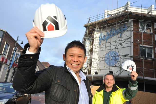 Steven Kwan with BP Multi Service's Andy Phillips outside the former Joplings store.