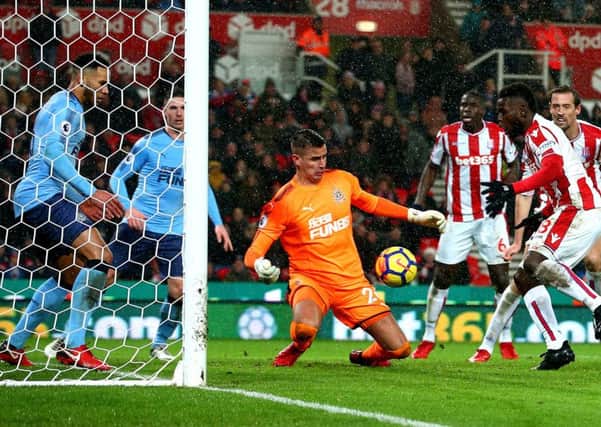 Newcastle keeper Karl Darlow makes a crucial, late save to deny Mame Biram Diouf at Stoke