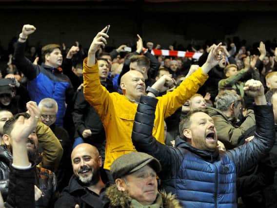 Sunderland fans celebrate the victory.