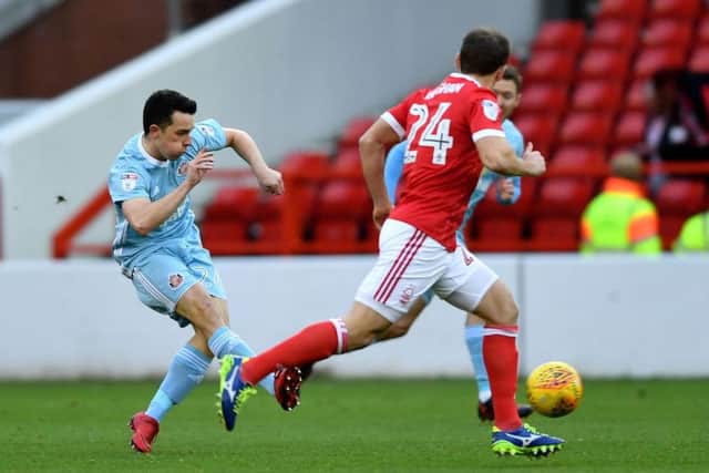 George Honeyman in action at The City Ground.