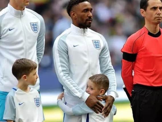A tender moment between Jermain Defoe and Bradley Lowery during the England match at Wembley Stadium