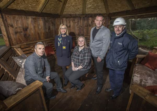 Staff from Miller Homes and Together for Children Sunderland inside the yurt close to the Scholars Gate development in Shiney Row.