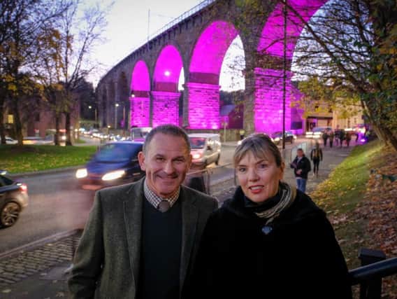 Allan Cook and Sarah Coop in front of the Railway Arches, pictured during Lumiere 2017. The display is to become a permanent installation.
