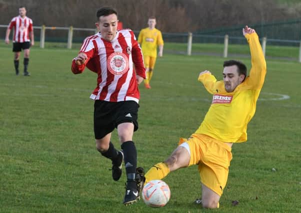 Sunderland West End (red/white) attack against Gateshead Rutherford in last month's Durham County Trophy tie. Picture by Kevin Brady