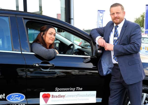 Gemma Lowery with Shaun Steed, new and used car sales manager at Bristol Street Motors Hartlepool Ford.
