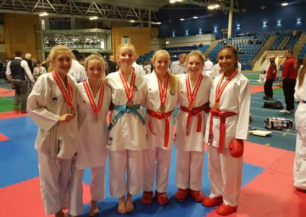 From left to right, Lucy Dixon, Elle Smith, Eve Palmer, Eleisha Mitchinson, Katie Hunnam and Anjalee Dhaliwal celebrate success at the North of England Karate Championship.