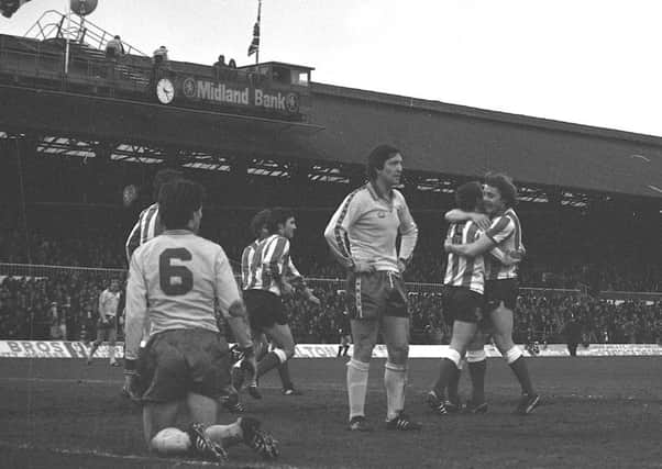 John Hawley (right) congratulates Gary Rowell on his opening goal against Norwich in 1981.