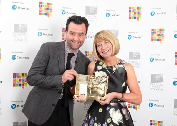 Lynn Green is presented with her award by actor Daniel Mays.