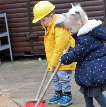 Pupils at Pennywell Early Years Centre helping with the clean up.