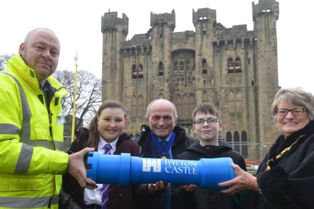 Hylton Castle time capsule from school children and local community.
Sunderland mayor Coun Doris MacKnight hands over the capsule to John Hutton from William Birch contactors. School children Lewis Foster, 14 and Paige Thurlbeck, 13 from Castle View Enterprise Academy with moayor consort Keith MacKnight