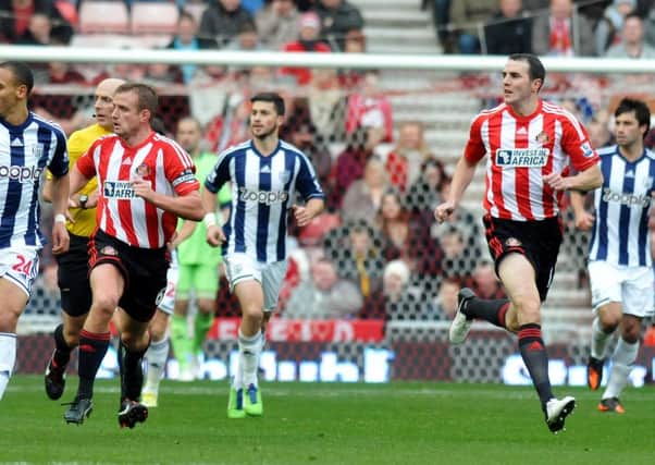 Sunderland's Lee Cattermole and John O'Shea in action back in 2012.