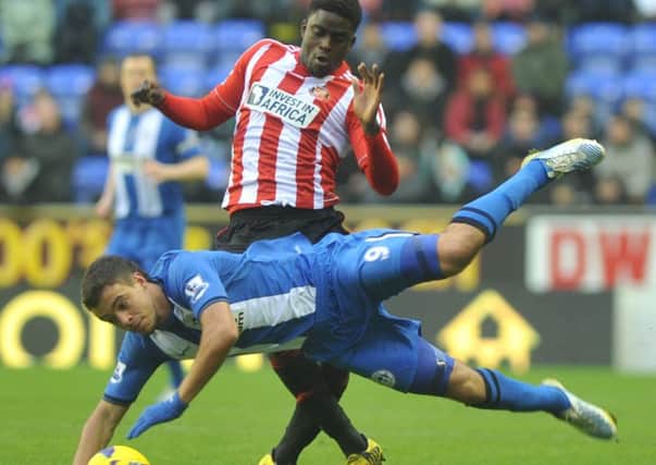 Wigans Franco Di Santo goes flying under a challenge from Sunderland midfielder Alfred NDiaye