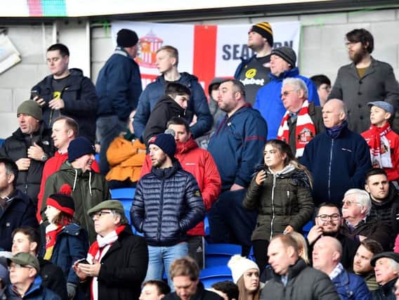 A mainly glum-looking section of the loyal Sunderland away following at Cardiff City recently.