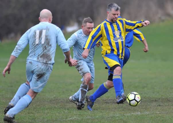 Over-40s League action: Rolls Royce (blue) take on The Philadelphia last week. Picture by Tim Richardson
