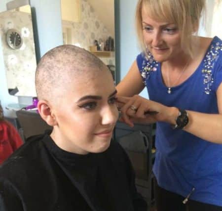 Natalia Rooks has her head shaved