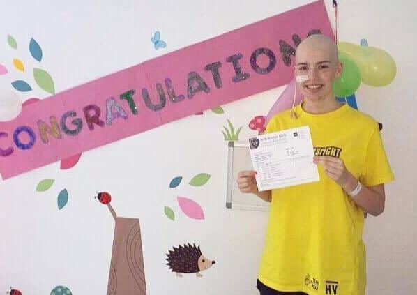 Natalia Rooks with her great exam results despite undergoing gruelling treatment.