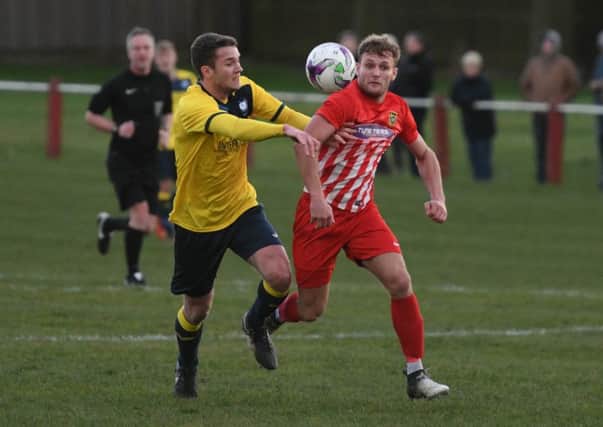 Ryhope CW (red/white) take on Whitley Bay in Division One last month.