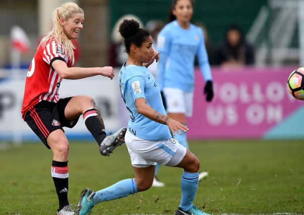 Sunderland Ladies' Rachel Pitman clears under pressure from Manchester City's Demi Stokes. Picture by Frank Reid