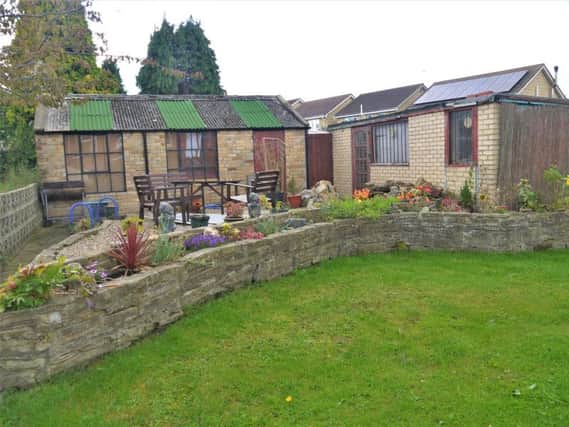The property includes a three-bedroom home with a family-friendly garden and beautiful views over open countryside towards the city of Durham