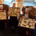 (L-R) Mary Richardson, 83, Ethel Elliot, 95, Ellen Haley, 85,and Joan Dobson, 85, with the collages.