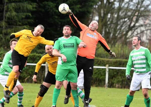 Over-40s action as Penshaw Catholic Club  (yellow) battle against Thornley Celtic last week. Picture by Kevin Brady