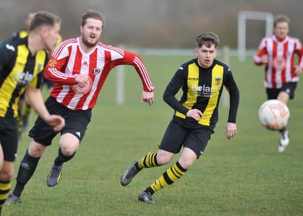 Sunderland West End (red/white) take on Hebburn Town Reserves last weekend. Picture by Tim Richardson