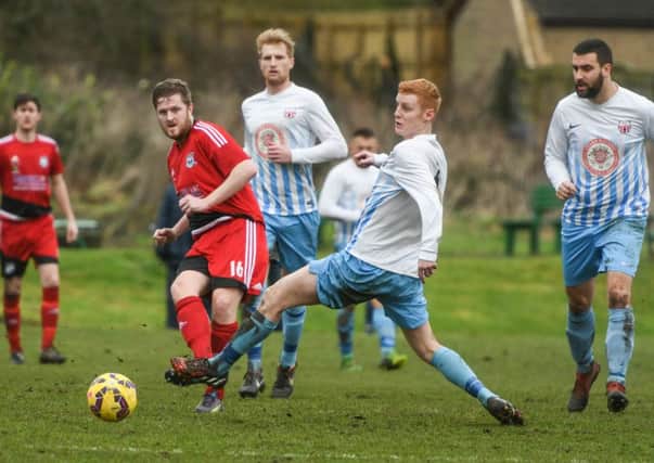 Southwick (red) take on Victoria Gardens in last week's League Cup semi-final. Picture by Kevin Brady