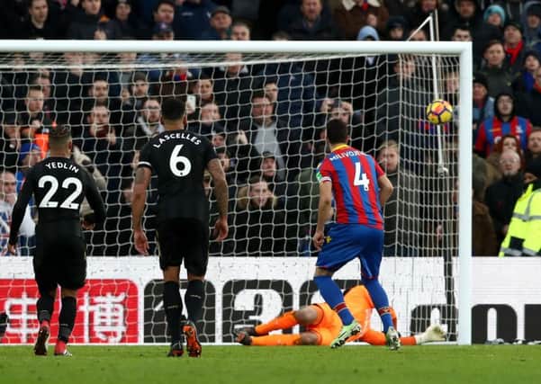 Crystal Palace's Luka Milivojevic (right) scores his side's first goal of the game from the penalty spot during the Premier League match at Selhurst Park.