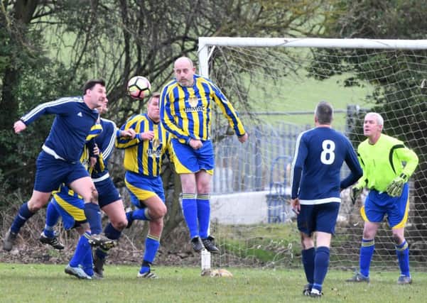 Over-40s League action as The Philadelphia (yellow/blue) fight it out with Hartlepool Stag & Monkey last week. Picture by Kevin Brady