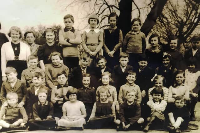 Tommy Pulling at school, third from right in the second row.
